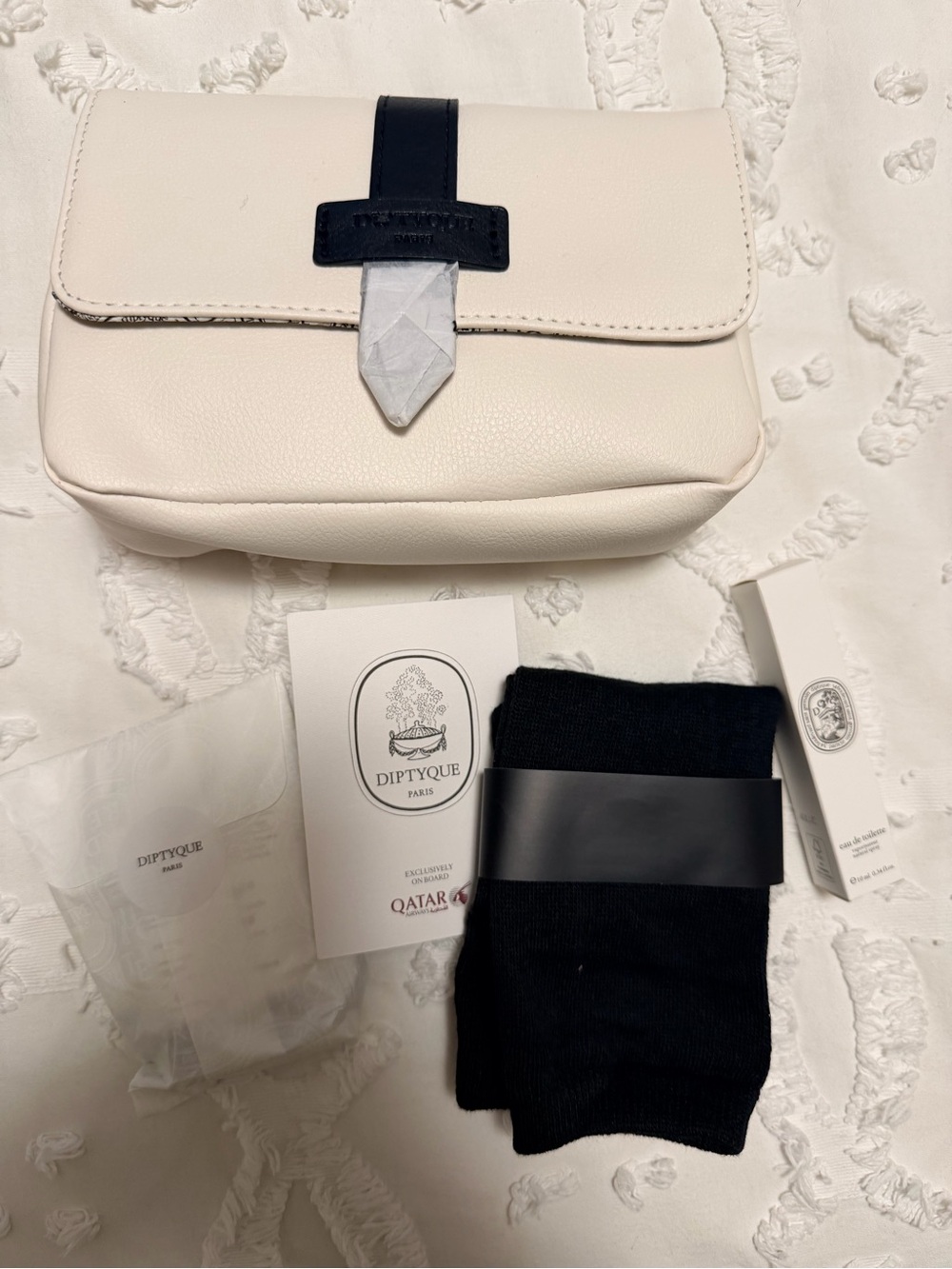 diptyque amenity kit with all unopened items, including the pouch